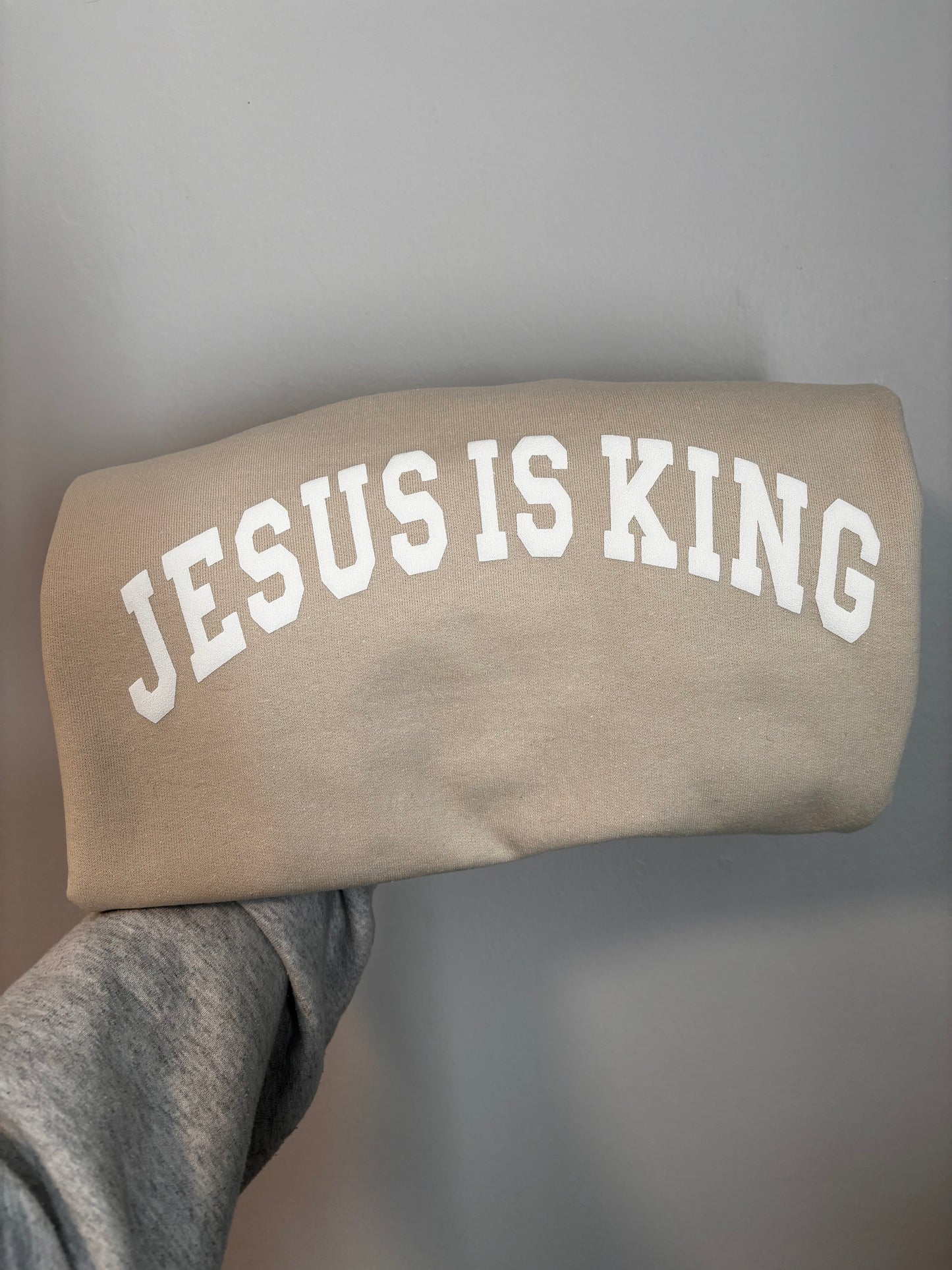 Jesus is King - white puff on cream